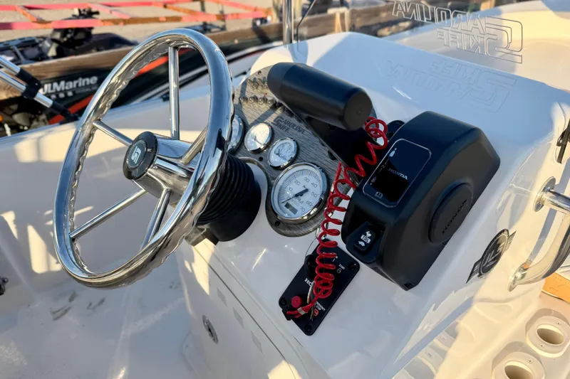 Slide: The Image of Steering console of 2026 Carolina Skiff 178 JLS boat with gauges and controls. - 25