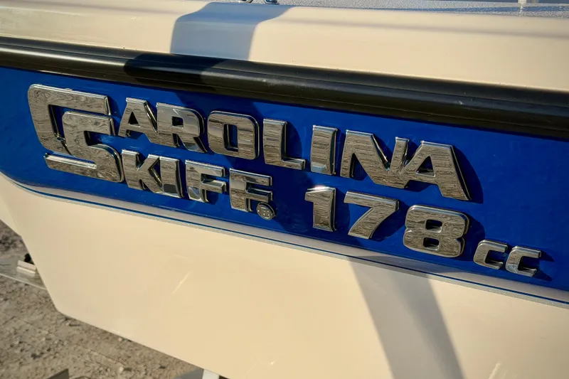 Slide: The Image of 2026 Carolina Skiff 178 JLS boat logo on blue and white background. - 3