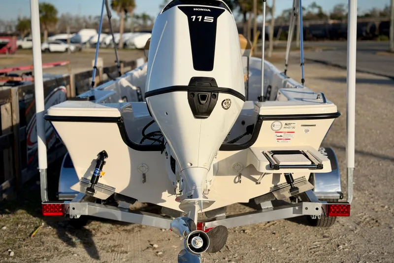 Slide: The Image of 2026 Carolina Skiff 178 JLS boat with Honda 115 outboard motor on trailer. - 4