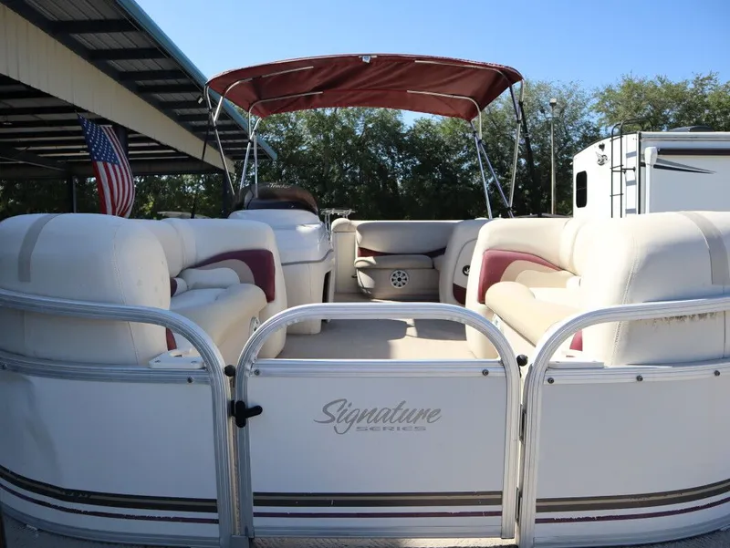 Slide: The Image of 2011 Sun Tracker Party Barge 21 with seating area and canopy. - 10
