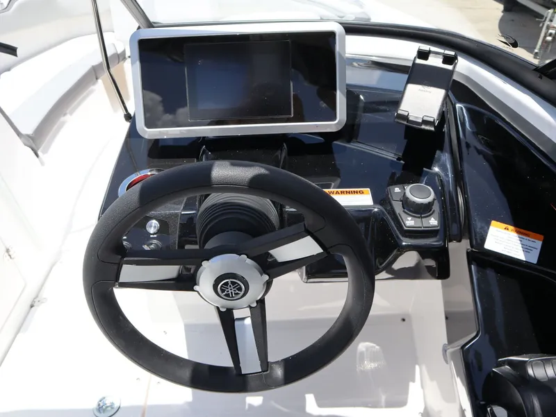 Slide: The Image of Yamaha Boats SX250 2026 helm with steering wheel and display. - 11