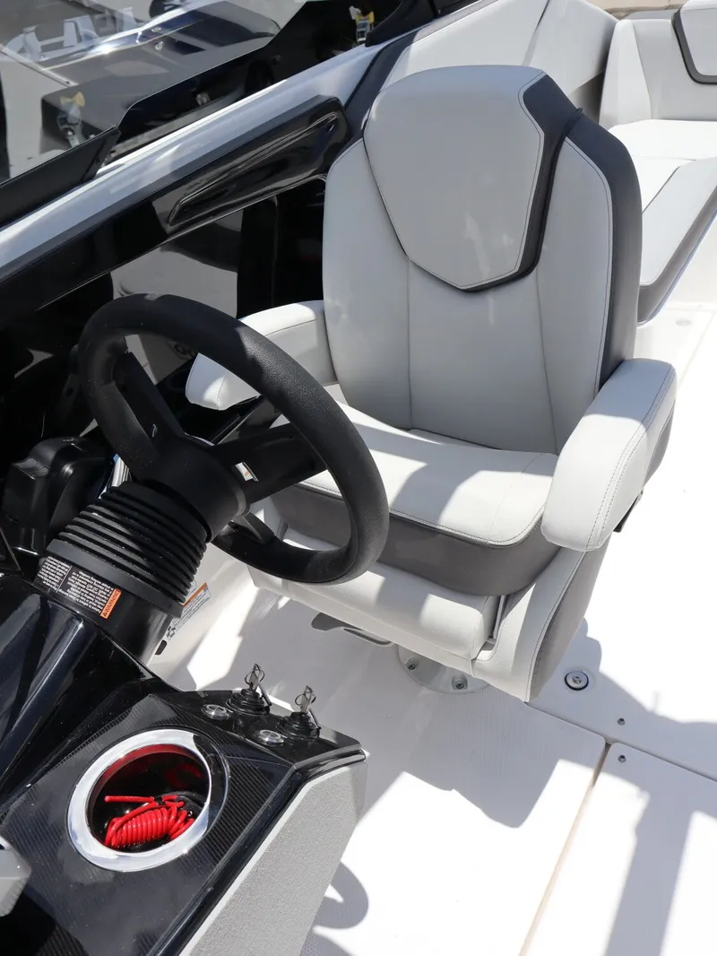Slide: The Image of Interior of 2026 Yamaha Boats SX250 with steering wheel and seat. - 12