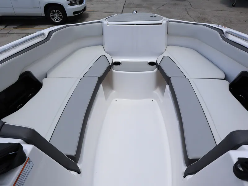 Slide: The Image of Interior of 2026 Yamaha Boats SX250 with gray and white seating. - 14