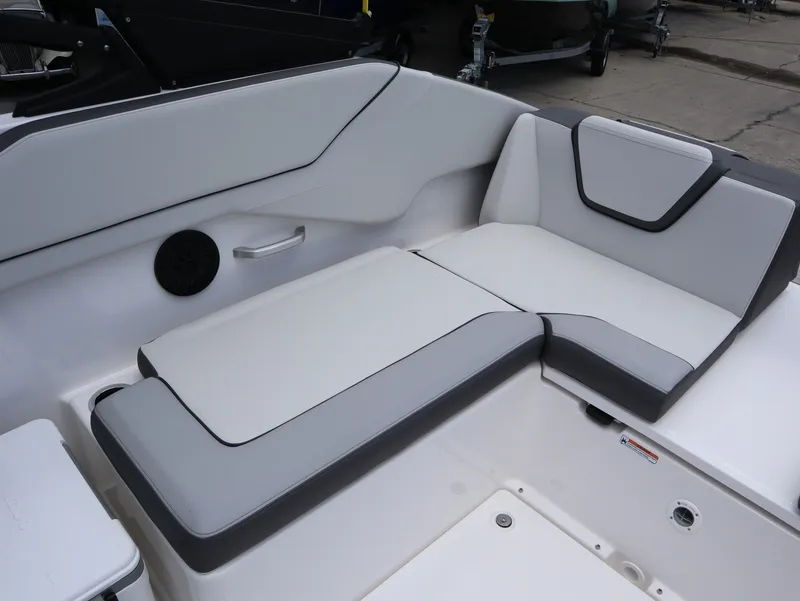 Slide: The Image of Interior of Yamaha SX250 boat, 2026 model, featuring gray and white seating. - 23