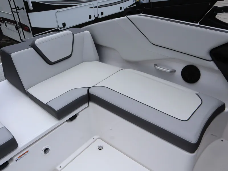 Slide: The Image of Interior of 2026 Yamaha Boats SX250 with gray and white seating. - 24