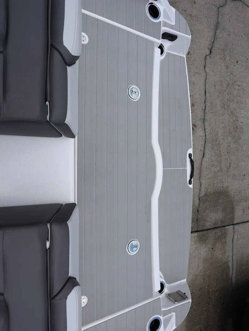 Slide: The Image of Yamaha Boats SX250 2026, gray deck with black seating. - 25