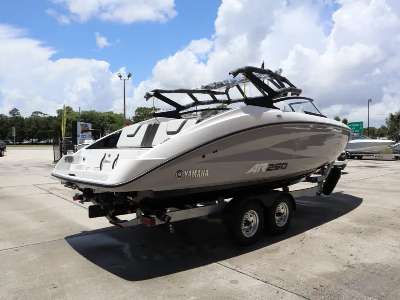 Slide: The Image of 2026 Yamaha SX250 boat on trailer in sunny weather. - 6