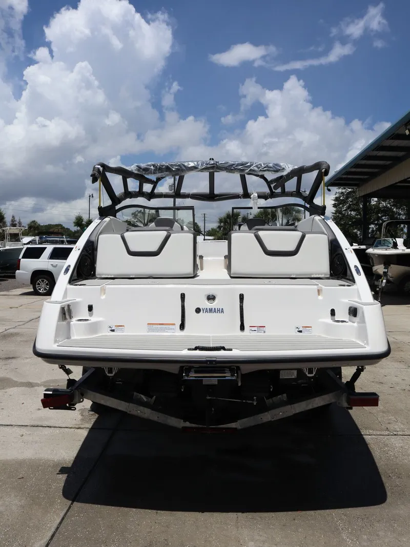 Slide: The Image of Rear view of 2026 Yamaha Boats SX250 under blue sky. - 7