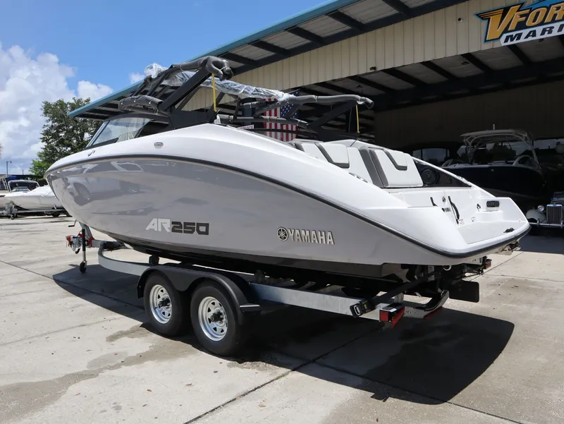 Slide: The Image of Yamaha SX250 boat 2026 on trailer outside warehouse. - 8