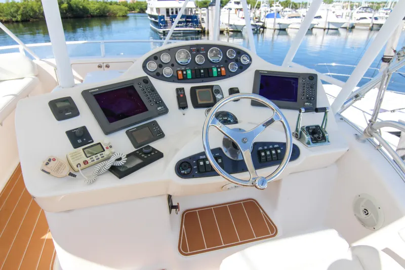 Slide: The Image of Helm of 2006 Riviera 47 Open Flybridge Series II with navigation equipment and controls. - 11
