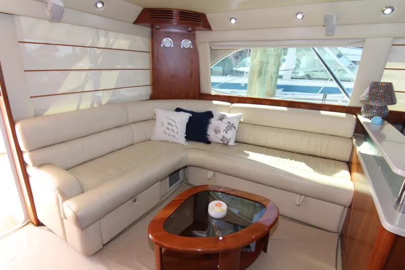 Slide: The Image of Luxurious interior of 2006 Riviera 47 Open Flybridge yacht with plush seating and elegant decor. - 20