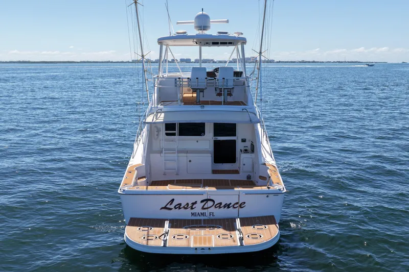 Slide: The Image of 2006 Riviera 47 Open Flybridge Series II yacht on calm ocean waters. - 35