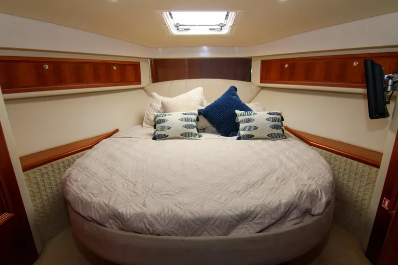 Slide: The Image of Luxurious bedroom interior of 2006 Riviera 47 Open Flybridge Series II yacht. - 36
