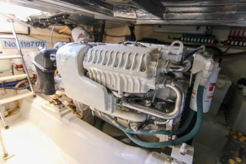 Slide: The Image of Engine room of 2006 Riviera 47 Open Flybridge Series II yacht, showcasing machinery and components. - 37