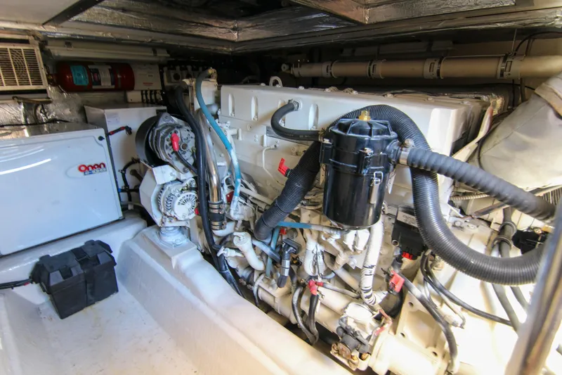 Slide: The Image of Engine room of a 2006 Riviera 47 Open Flybridge Series II yacht, showcasing machinery and components. - 41