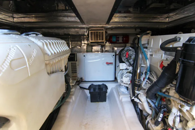 Slide: The Image of Engine room of 2006 Riviera 47 Open Flybridge Series II yacht. - 43
