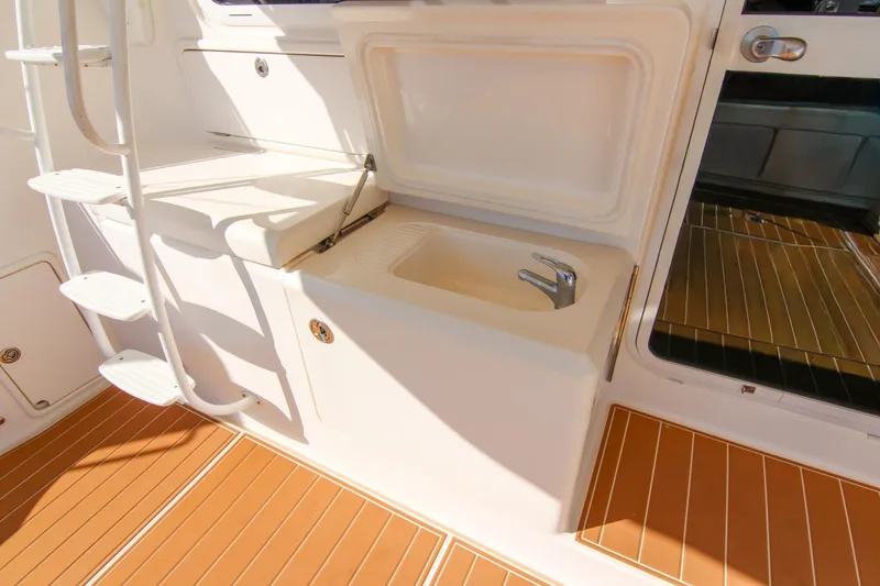 Slide: The Image of 2006 Riviera 47 Open Flybridge Series II yacht interior with sink and ladder. - 45
