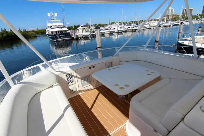Slide: The Image of Luxurious 2006 Riviera 47 Open Flybridge yacht interior with marina view. - 8