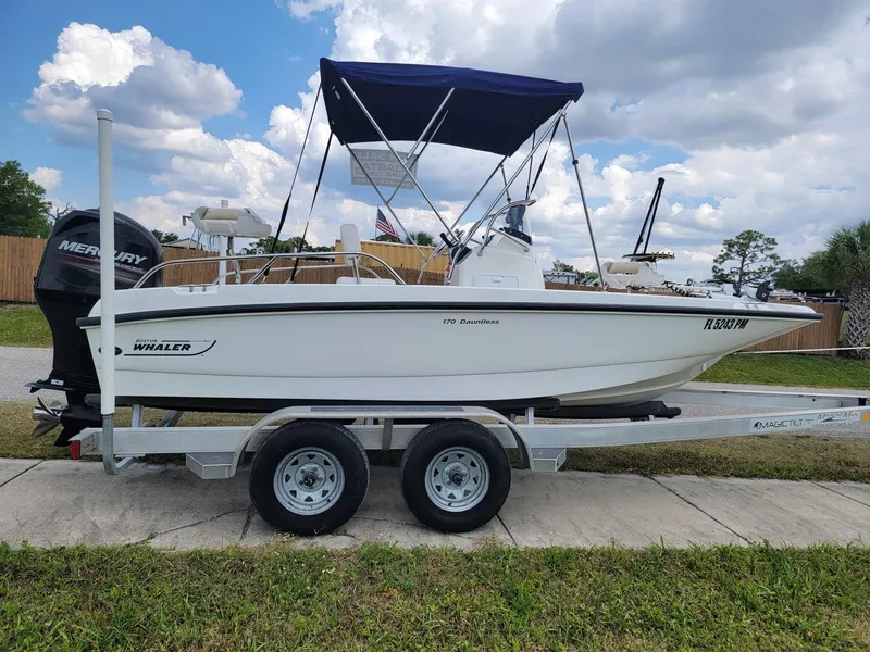 The Image of 2013 Boston Whaler 170 Dauntless on trailer, blue sky. - 1