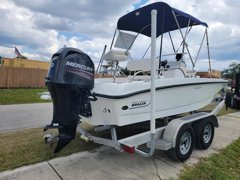 Slide: The Image of 2013 Boston Whaler 170 Dauntless boat on trailer with Mercury engine. - 4