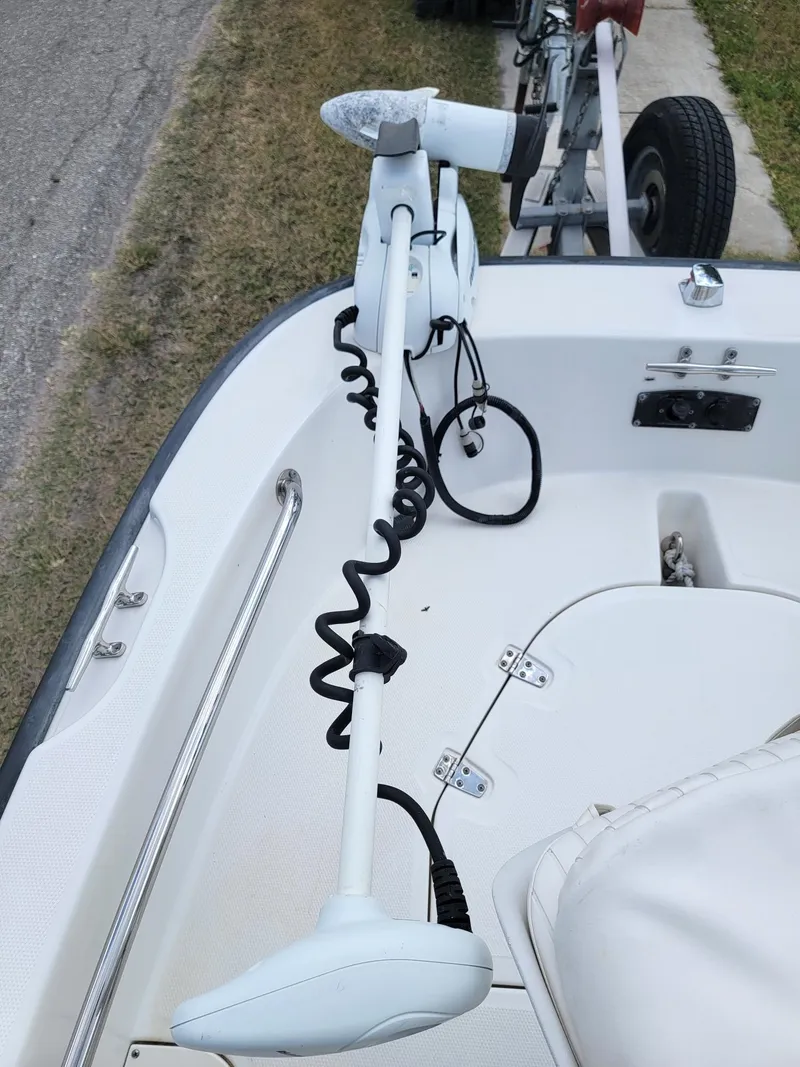Slide: The Image of 2013 Boston Whaler 170 Dauntless with mounted outboard motor. - 8