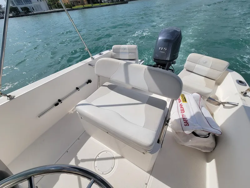 Slide: The Image of Interior of a 2013 Edgewater 170CC boat on the water. - 5