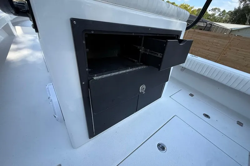 Slide: The Image of Open storage compartment on 2017 Dorado 25 SE boat deck. - 13