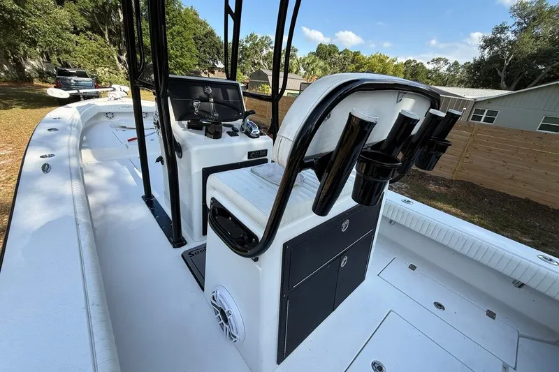 Slide: The Image of 2017 Dorado 25 SE boat interior with seating and rod holders. - 14