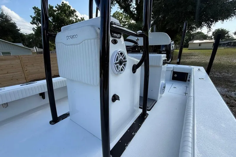 Slide: The Image of 2017 Dorado 25 SE boat interior with steering console and seating. - 21