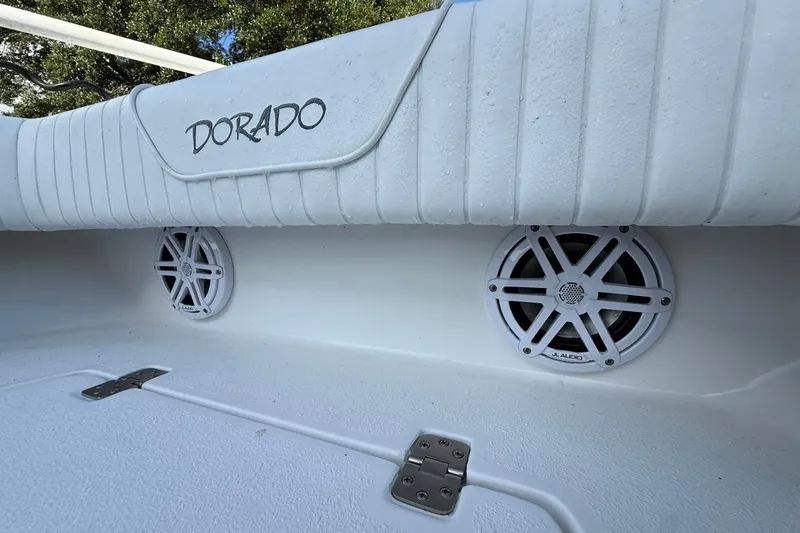 Slide: The Image of 2017 Dorado 25 SE boat interior with speakers and branded upholstery. - 26