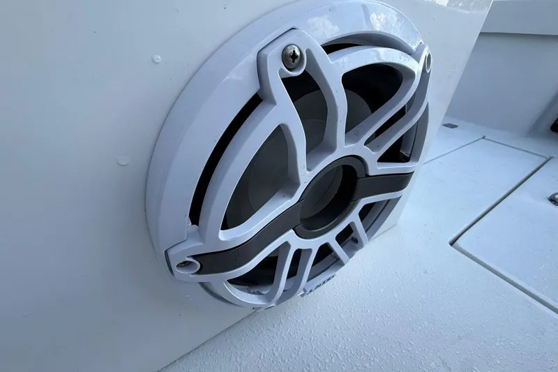 Slide: The Image of Close-up of a speaker on a 2017 Dorado 25 SE boat. - 27