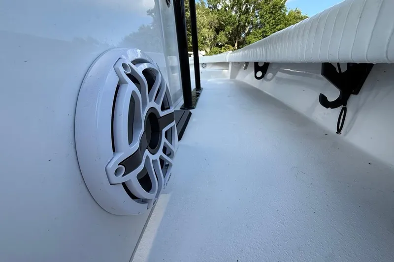 Slide: The Image of Close-up of a 2017 Dorado 25 SE boat interior with speaker and seating. - 28
