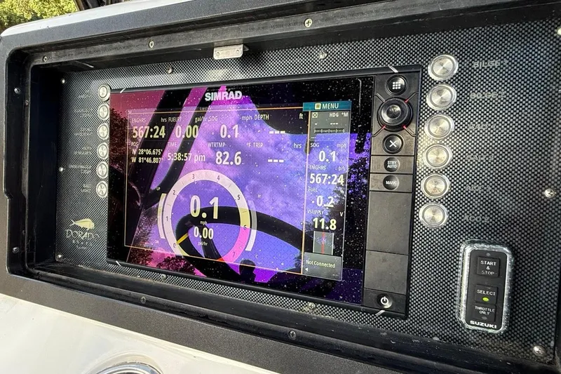 Slide: The Image of Simrad navigation display on 2017 Dorado 25 SE boat dashboard. - 31