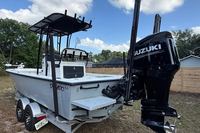 Slide: The Image of 2017 Dorado 25 SE boat with Suzuki outboard motor on trailer. - 8