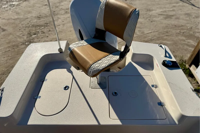 Slide: The Image of 2025 Carolina Skiff 192 JLS boat seat and deck, featuring storage compartments. - 15