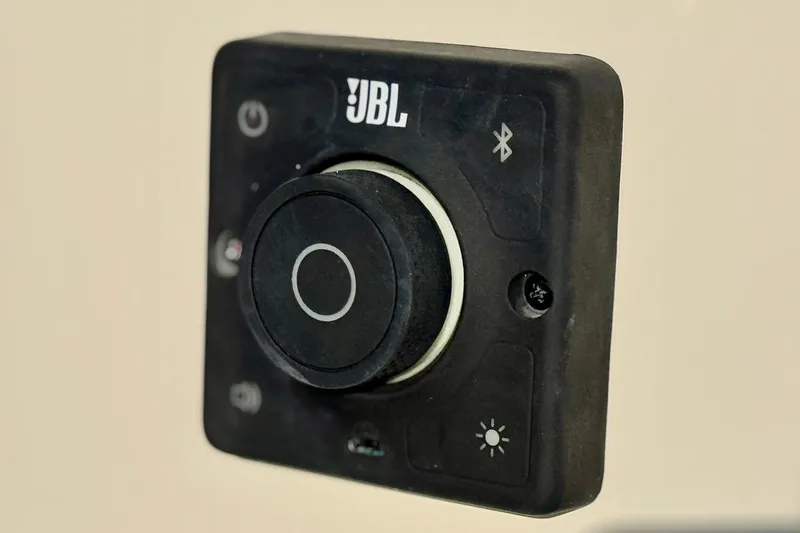 Slide: The Image of JBL control panel on 2025 Carolina Skiff 192 JLS boat, featuring Bluetooth connectivity. - 21