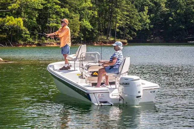 Slide: The Image of Manufacturer Provided Image: Two people fishing on a 2025 Carolina Skiff 192 JLS boat in a serene lake. - 24