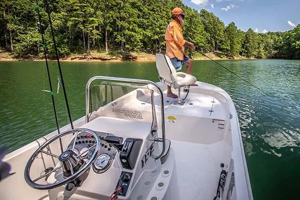 Slide: The Image of Manufacturer Provided Image: Man fishing on a 2025 Carolina Skiff 192 JLS boat in a scenic lake. - 26