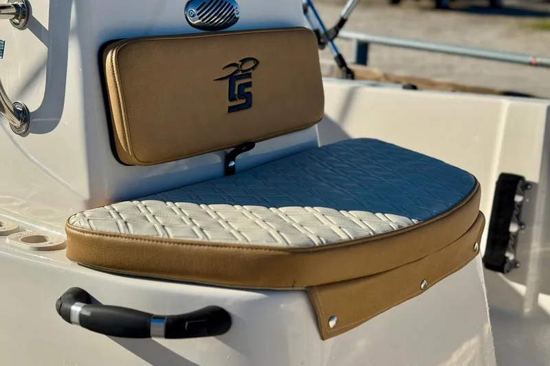 Slide: The Image of 2025 Carolina Skiff 192 JLS boat seat with tan and white upholstery. - 3