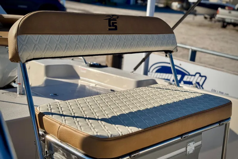 Slide: The Image of 2025 Carolina Skiff 192 JLS boat seat with tan and white upholstery. - 4