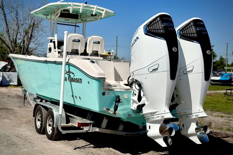 The Image of 2023 Sea Chaser 30 HFC CC boat with dual Honda outboard engines on a trailer. - 0