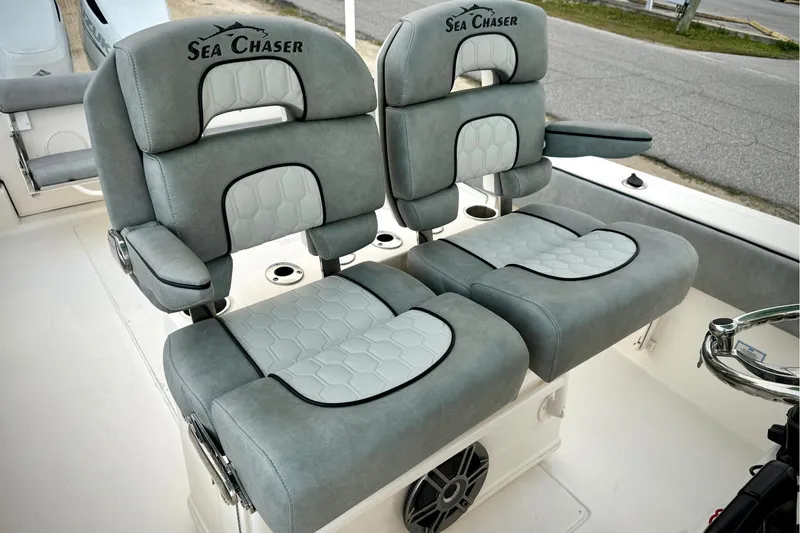 Slide: The Image of 2023 Sea Chaser 30 HFC CC boat seats with gray and white upholstery. - 11
