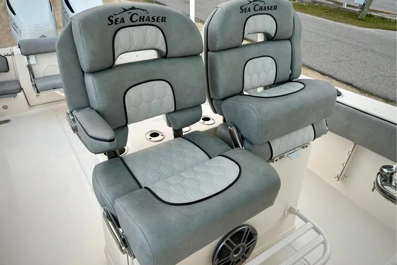 Slide: The Image of 2023 Sea Chaser 30 HFC CC boat seats with gray upholstery and logo embroidery. - 12