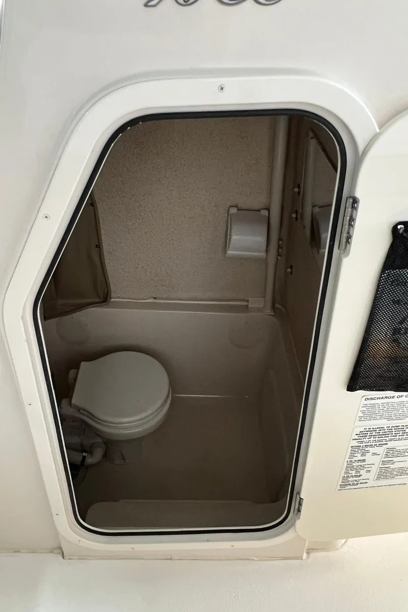 Slide: The Image of 2023 Sea Chaser 30HFC boat interior bathroom with toilet. - 17