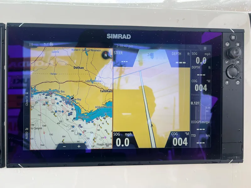 Slide: The Image of Simrad navigation display on 2023 Sea Chaser 30HFC boat showing map and sonar. - 19