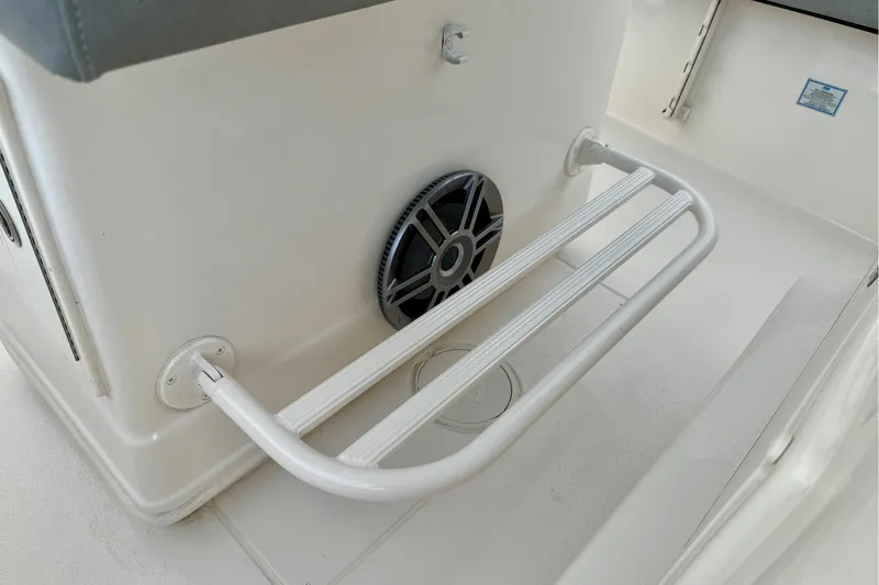 Slide: The Image of 2023 Sea Chaser 30 HFC CC boat interior with footrest and speaker. - 21