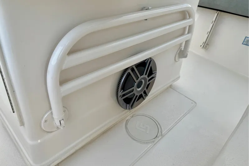 Slide: The Image of 2023 Sea Chaser 30 HFC CC boat interior with speaker and railing detail. - 22