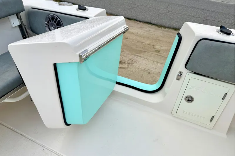 Slide: The Image of 2023 Sea Chaser 30 HFC CC boat interior with storage compartment and seating. - 29