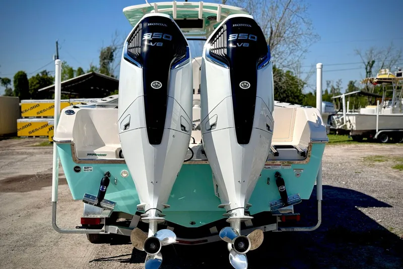 Slide: The Image of 2023 Sea Chaser 30 HFC CC with dual Honda 350 V8 engines, rear view. - 3