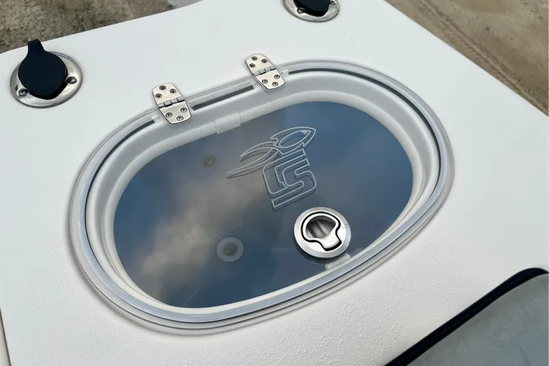 Slide: The Image of 2023 Sea Chaser 30 HFC CC boat hatch with logo and secure latch. - 30
